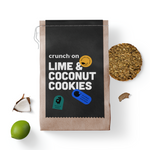 Front view of bag of Crunch On Lime & Coconut Cookies, with cookie, lime and coconut in the background